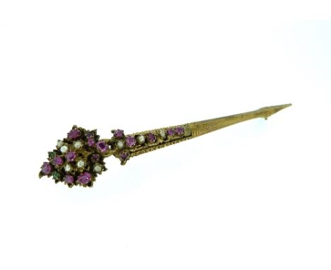 An arrow shaped Brooch / Pin, set with pale emeralds, rubies and seed pearls, in unmarked yellow metal, probably Ceylonise.