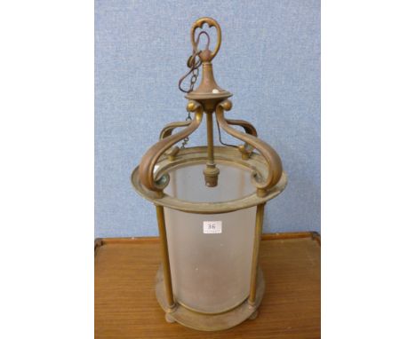 An Arts and Crafts brass and glass hanging lantern