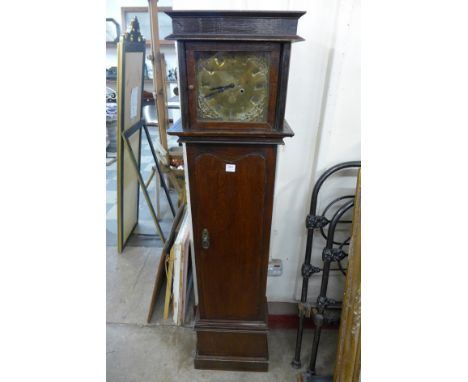 An oak dwarf longcase clock
