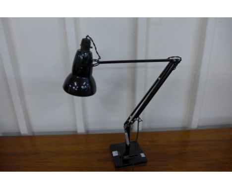 A black metal anglepoise lamp