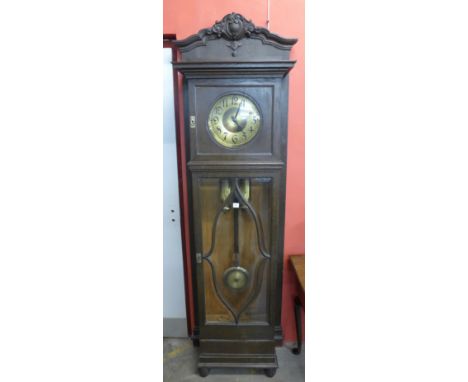 An early 20th Century German oak double weight longcase clock