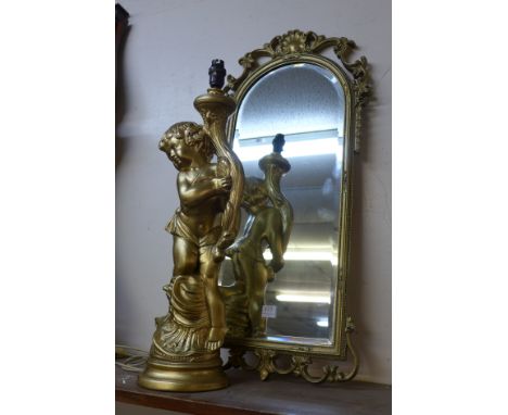 A cherub lamp and a gilt hall mirror