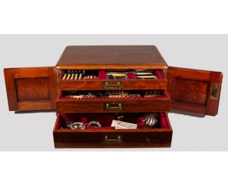 EDWARDIAN OAK THREE DRAWER CANTEEN NOW HOUSING AN ASSORTMENT OF NON-ASSOCIATED PLATED CUTLERY, bone handled knives, etc., als