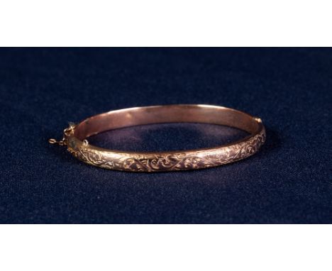 LATE VICTORIAN 9ct  GOLD HOLLOW BANGLE, hinge opening with foliate scroll engraved top, Birmingham 1900, 6.7gms  