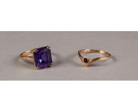 9ct GOLD DRESS RING, set with a synthetic oblong amethyst, and a  9ct GOLD RING, the 'V' shaped top set with a tiny garnet, 4