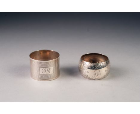 TWO SILVER NAPKIN RINGS, one engine turned, Sheffield 1935, the other floral engraved, Sheffield 1903, 1.9oz, (2)