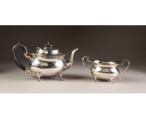 INTER-WAR YEARS SILVER TEAPOT AND MATCHING TWO HANDLED SUGAR BASIN, of rounded oblong form with everted rims, black wood hand