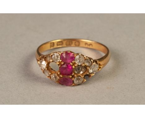 VICTORIAN 18ct GOLD, RUBY AND DIAMOND RING, cross set with three rubies and flanked by a lozenge shaped setting of nine old c