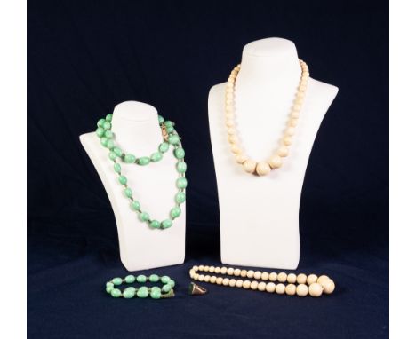 TWO VICTORIAN SINGLE STRAND NECKLACES OF GRADUATED ROUND IVORY BEADS; long necklace of green oval beads (in two parts) and 9c