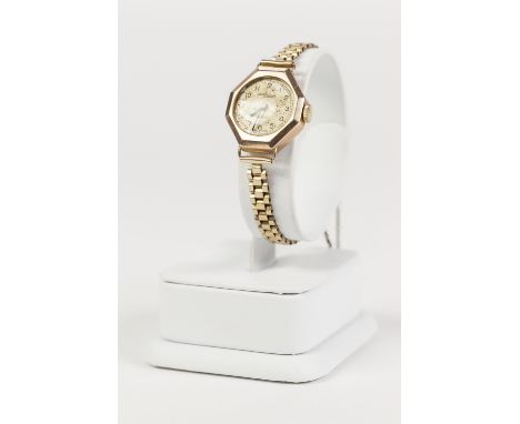 LADY'S THOMAS RUSSELL AND SON, 9ct GOLD WRIST WATCH, with Swiss 15 jewel movement, circular silvered Arabic dial, in octagona