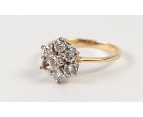 18ct  GOLD AND DIAMOND DAISY CLUSTER RING, set with six (of seven) diamonds, London import mark 1990, approx .60ct in total ,