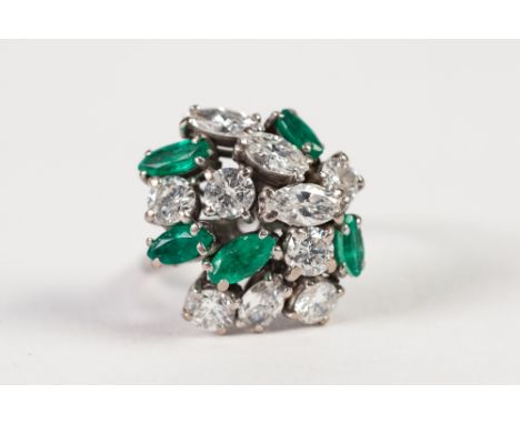 18ct WHITE GOLD, DIAMOND AND EMERALD COCKTAIL RING, set with six round brilliant cut diamonds, four marquise shaped diamonds 