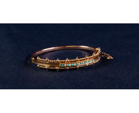 CASED LATE VICTORIAN 9ct GOLD TINY TURQUOISE AND SEED PEARL SET STIFF BANGLE, engraved to the inside 'Stephen 25th Sept 1900'