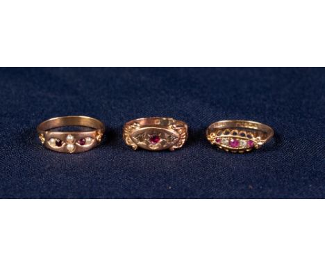 18ct GOLD RING SET WITH TWO TINY DIAMONDS AND THREE TINY RUBIES, another GOLD COLOURED METAL RING, a tiny garnet and seed pea