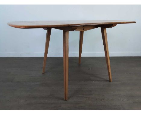 ERCOL DROP LEAF DINING TABLE,in elm and beech, on splayed supports, 138cm longCondition good to fair. Light wear throughout c