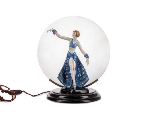 ART DECO FIGURAL TABLE LAMP,modelled with porcelain figure of a dancer in front of a circular frosted glass shade, ebonised b