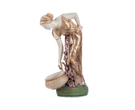 AUSTRIAN AMPHORA POTTERY FIGURE OF A MAIDEN,modelled with water pot, applied foliage, on circular base, impressed marks to ba