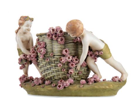 AUSTRIAN ART NOUVEAU PLANTER BY AMPHORA,the basket weave bowl richly applied with foliage, flanked by a young boy and girl, o