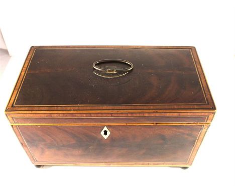 A George III mahogany and satinwood strung Tea Caddy, circa 1815, the hinged lid opening to reveal three lidded divisions rai