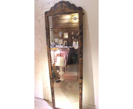 A large Chinoisserie mirror decorated with black ground and raised gilt chinoisserie detail.. Height 183cms x 56cms. The surr