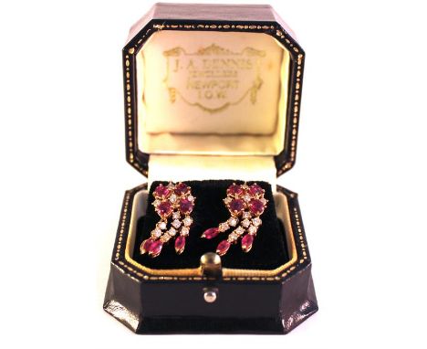 Pair of 18ct ruby and diamond drop earrings, hanging cluster of four oval-cut rubies interspersed with diamonds, suspending t