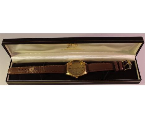 A cased 1970's Omega Seamaster watch, quartz movement with brown leather strap.