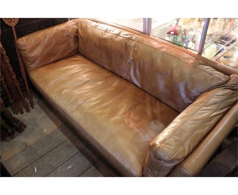 A modern design tan leather sofa.