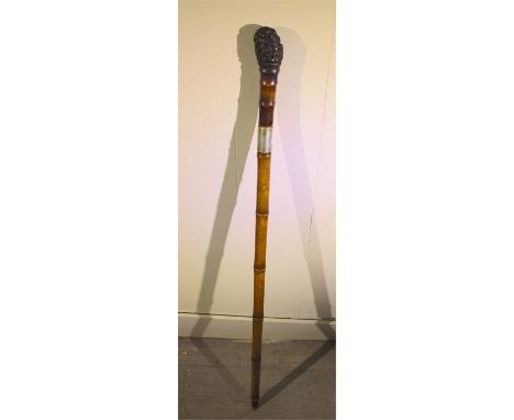 A late 19th Century sword stick, probably Wilkinson with engraved blade, terminating with knarled wood handle.