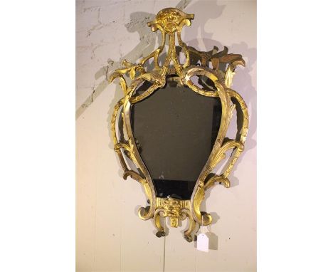 An 18th Century Florentine carved mirror. H-70cm