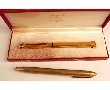 A Cartier fountain pen in original case along with an uncased Parker pen