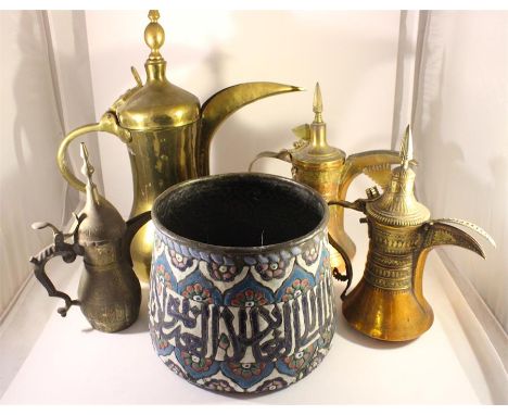 A collection of Islamic metalware , including an enamel calligraphy jardiniere.