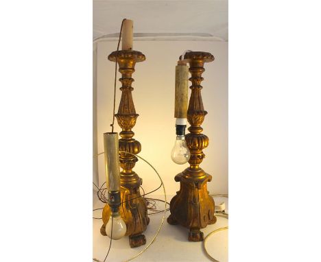 A pair of Florentine carved wooden gilt torchere lamp bases. Height 51 cms