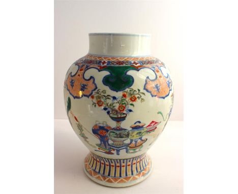  A Chinese 19th century Ginger Jar, decorated with enamel precious objects. Concentric circle mark to the base. Height 31cms.