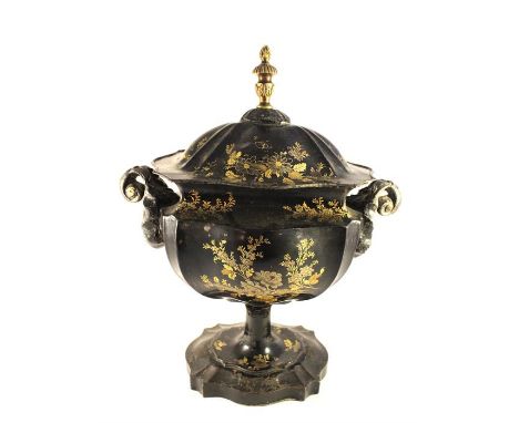 A Regency period Toleware chestnut vase with twin scroll handles and gilt finial. 32cms high