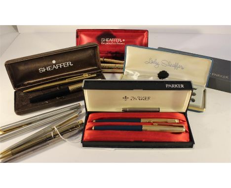 A collection of various fountain pens including a cased Patek Phillipe pen.