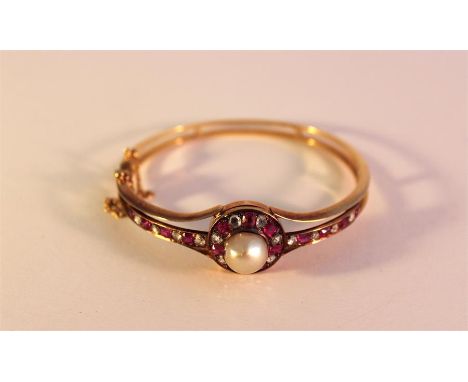 Early 20th cent gold bracelet with inset diamond and ruby with large central mounted pearl, in pristine condition, total weig