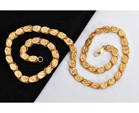 A YELLOW METAL CHAIN, designed with oval diamond cut detailed links, fitted with a lobster claw clasp, stamped '21k', length 