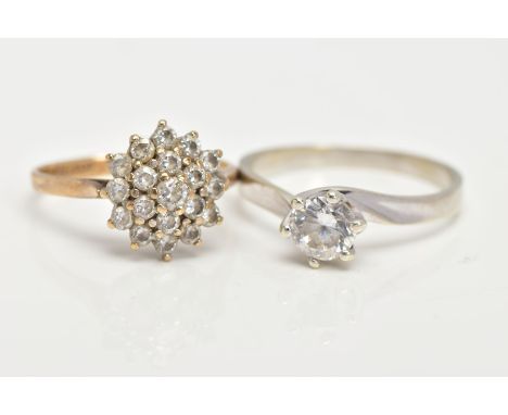TWO 9CT GOLD CUBIC ZIRCONIA RINGS, to include a white gold solitaire in a twisted claw setting , set with a single circular c