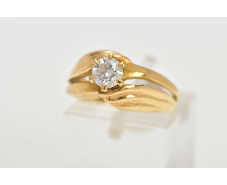 A YELLOW METAL SINGLE STONE DIAMOND RING, designed with a central six claw set, round brilliant cut diamond, estimated diamon