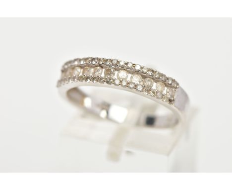 A 9CT WHITE GOLD DIAMOND HALF ETERNITY RING, designed with a central row of round brilliant cut diamonds set between two rows