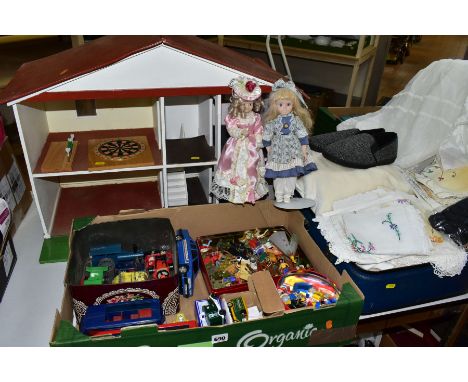 A 1960S/1970S WOODEN DOLLS HOUSE, modelled as a two storey detached house, open fronted with four rooms over two floors with 