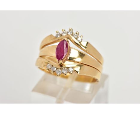 A YELLOW METAL RUBY AND DIAMOND PUZZLE RING, the centre ring designed with a tension set, marquise cut ruby, on a tapered pla
