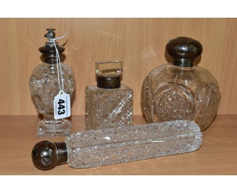 FOUR LATE VICTORIAN / EARLY 20TH CENTURY CUT GLASS SCENT BOTTLES AND FLASK WITH SILVER MOUNTS, including a globular bottle wi