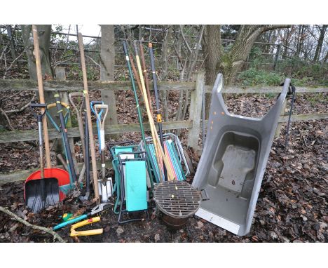 A QUANTITY OF GARDEN TOOLS, to include a plastic wheelbarrow, spades, shoves, three folding kneeler, BBQ, folding chair, etc 