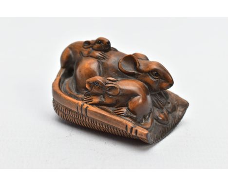 A CHINESE WOODEN NETSUKE, a small carved wooden netsuke depicting three mice in a basket, signed on the base, approximate hei