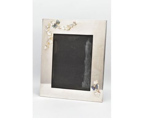 A LARGE SILVER-PLATED PHOTO FRAME, of a rectangular form plain polished design with applied floral, butterfly and dragonfly d