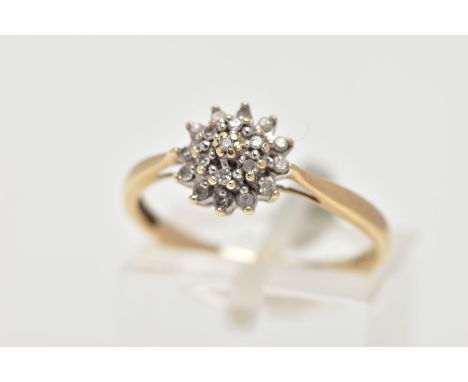 A 9CT GOLD DIAMOND CLUSTER RING, eighteen round brilliant diamonds, prong set as a cluster, pinched shoulders leading onto a 