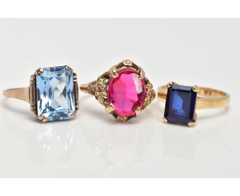 THREE GEMSET DRESS RINGS, to include an emerald cut sapphire ring set in a polished yellow metal, hallmarked 9ct gold Birming