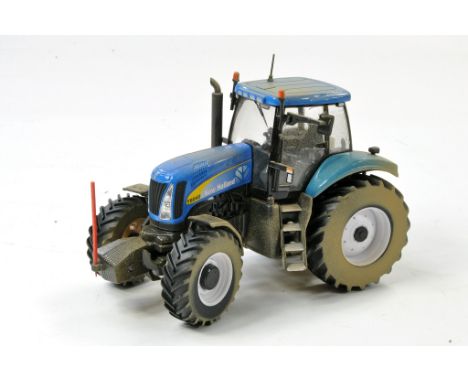 Britains 1/32 Code 3 - Weathered and Modified issue comprising New Holland T8040 Tractor. Appears very good to excellent. 