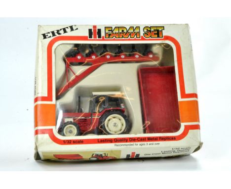 Ertl 1/32 No. 5066 International 784 Tractor and Implement Set. Contents excellent in good box with minor storage wear. 